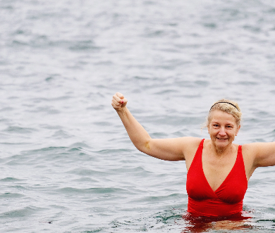 Lady in ed swim suit in the sea